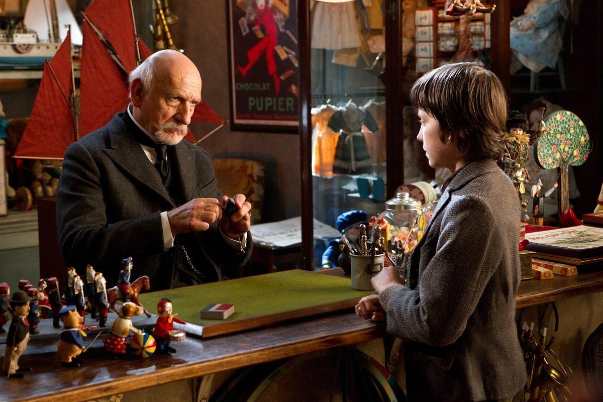 Christopher Lee stars as Monsieur Labisseqq and 	Asa Butterfield stars as Hugo Cabret in Paramount Pictures' Hugo (2011)
