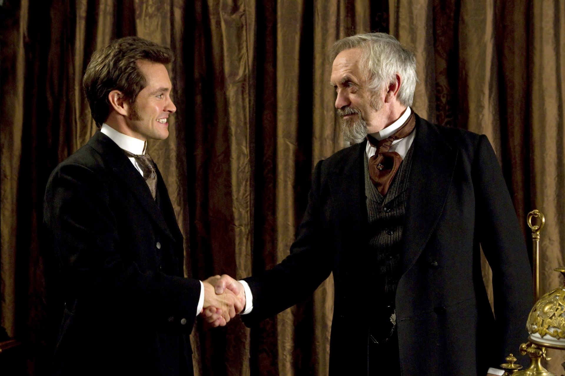 Hugh Dancy stars as Mortimer Granville and Jonathan Pryce stars as Dr. Dalrymple in Sony Pictures Classics' Hysteria (2012). Photo credit by Ricardo Vaz Palma.