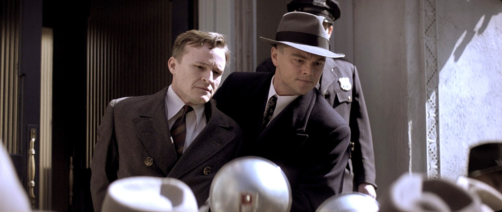 Damon Herriman stars as Bruno Hauptmann and Leonardo DiCaprio stars as J. Edgar Hoover in Warner Bros. Pictures' J. Edgar (2011)