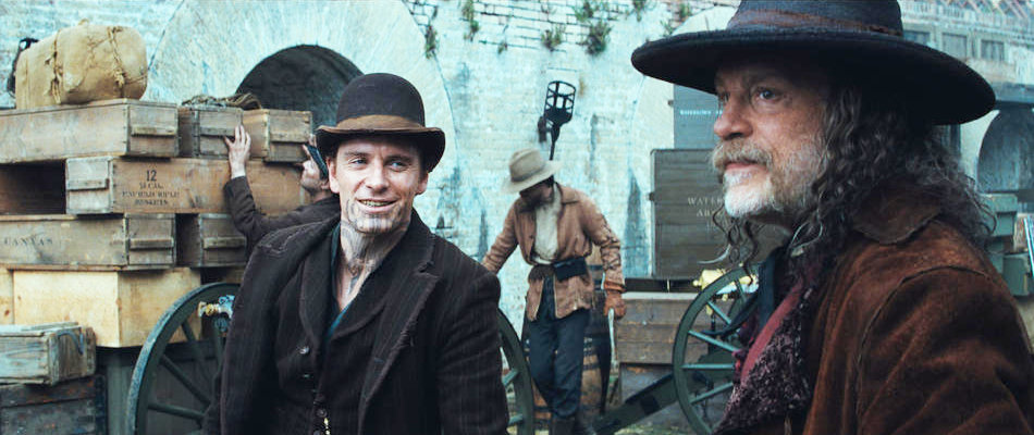 Michael Fassbender stars as Burke and John Malkovich stars as Quentin Turnbull in Warner Bros. Pictures' Jonah Hex (2010)