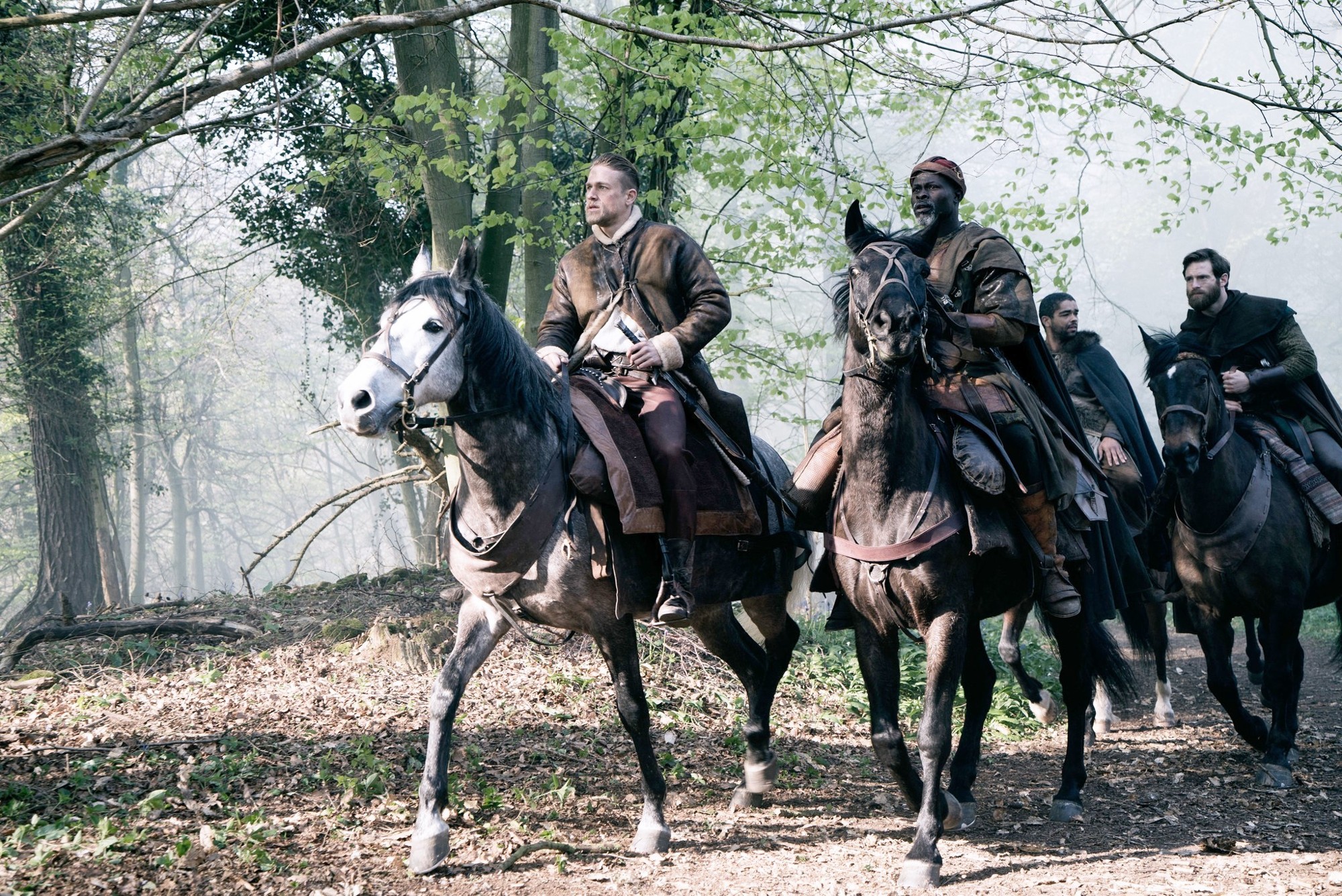 Charlie Hunnam stars as King Arthur and Djimon Hounsou stars as Sir Bedivere in Warner Bros. Pictures' King Arthur: Legend of the Sword (2017)