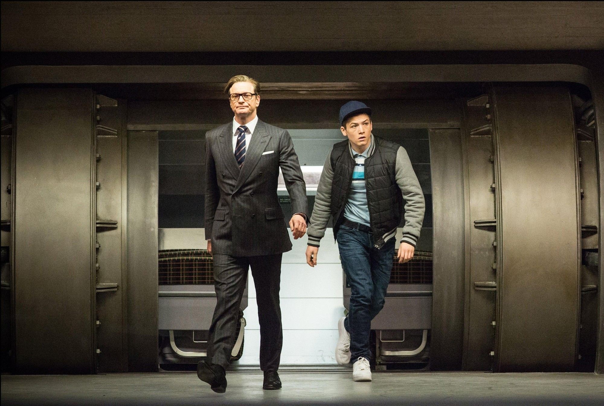 Colin Firth stars as Harry Hart/Galahad and Taron Egerton stars as Gary Unwin in 20th Century Fox's Kingsman: The Secret Service (2015)