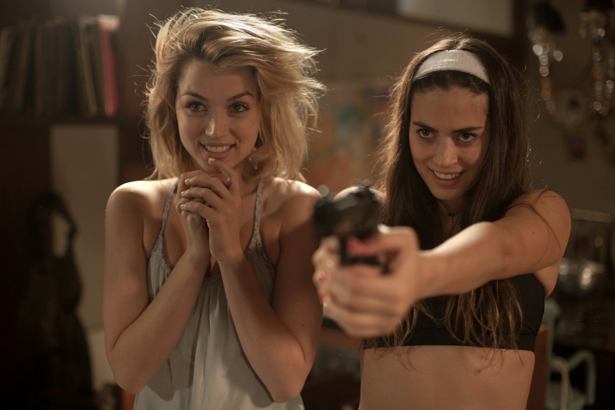 Ana de Armas stars as Bel and Lorenza Izzo stars as Genesis in Lionsgate Films' Knock Knock (2015)