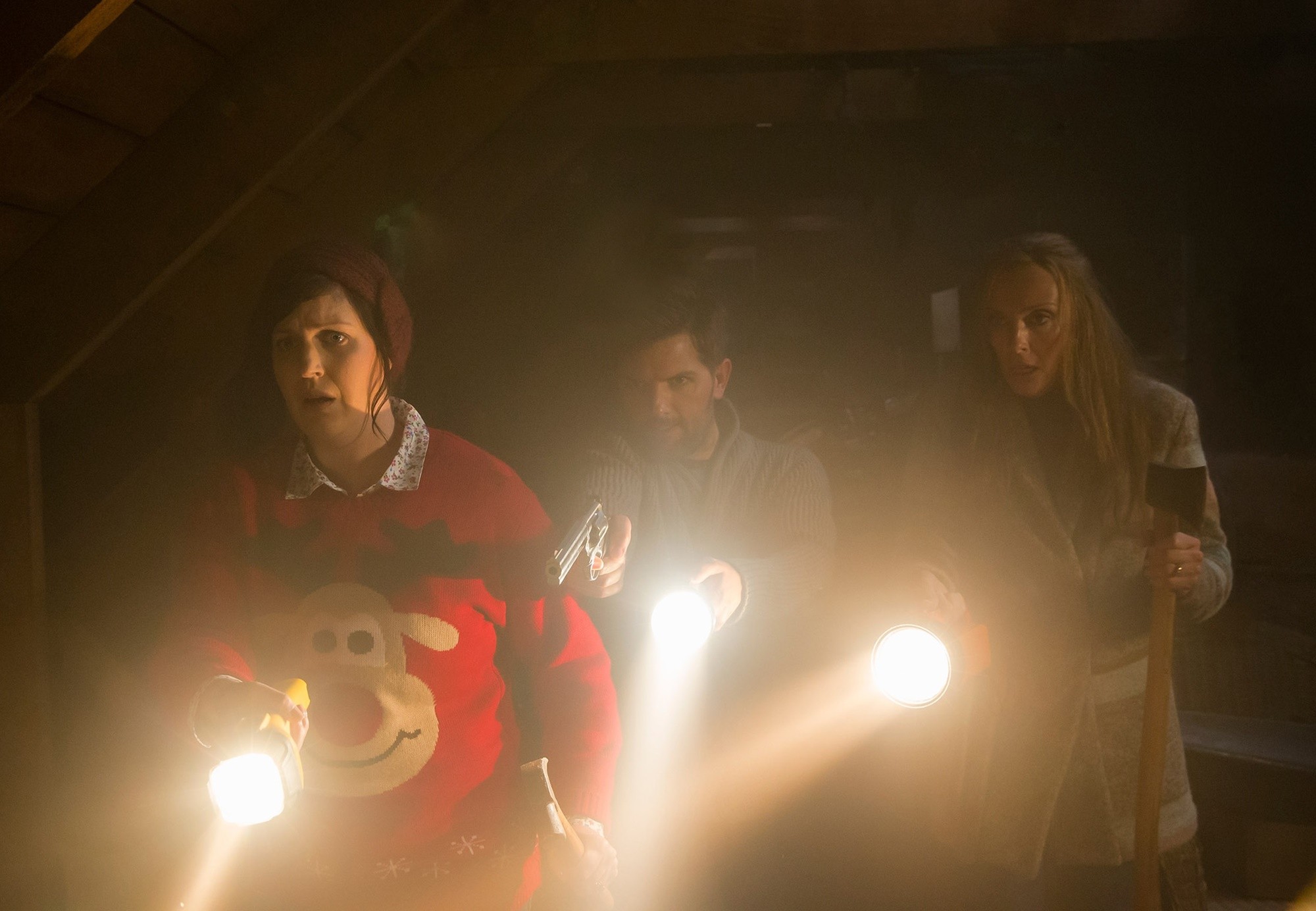 Allison Tolman, Adam Scott and Toni Collette in Universal Pictures' Krampus (2015)