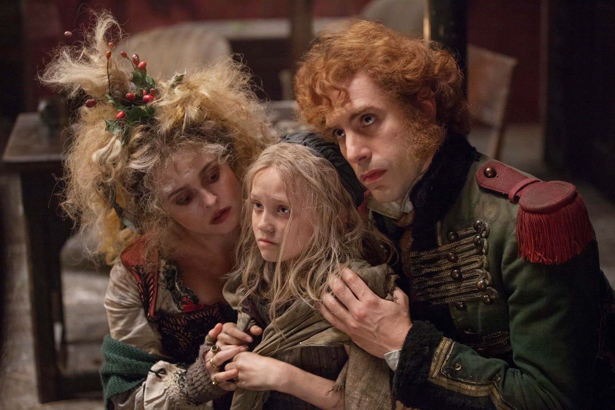 Sacha Baron Cohen, Isabelle Allen and Helena Bonham Carter in Universal Pictures' Les Miserables (2012)