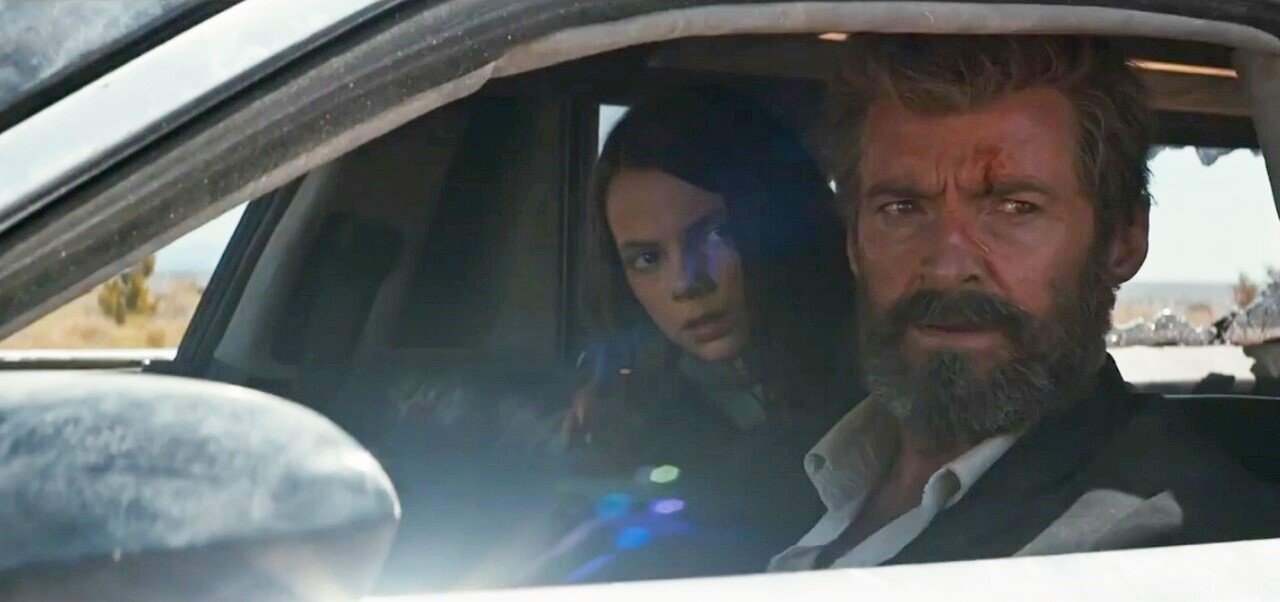 Dafne Keen stars as Laura and Hugh Jackman stars as Logan in 20th Century Fox's Logan (2017)