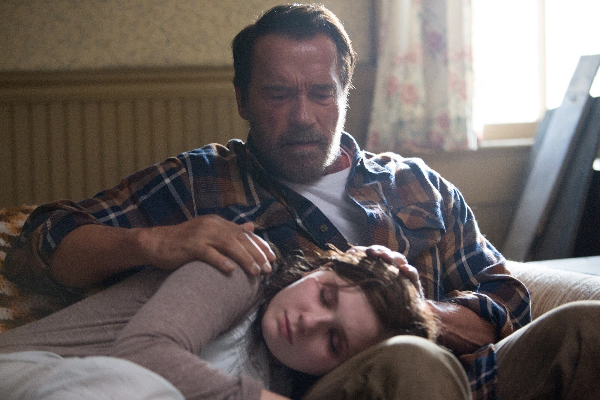 Abigail Breslin stars as Maggie and Arnold Schwarzenegger stars as Wade in Lionsgate Films' Maggie (2015)