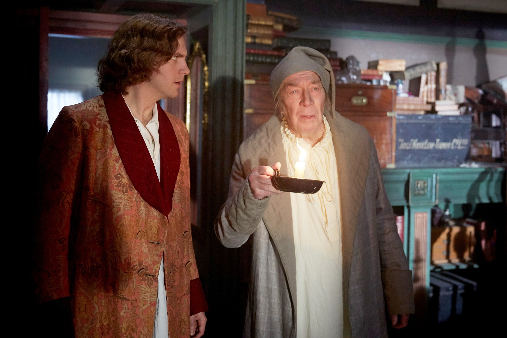 Dan Stevens stars as Charles Dickens and Christopher Plummer stars as Ebenezer Scrooge in Bleecker Street Media's The Man Who Invented Christmas (2017)