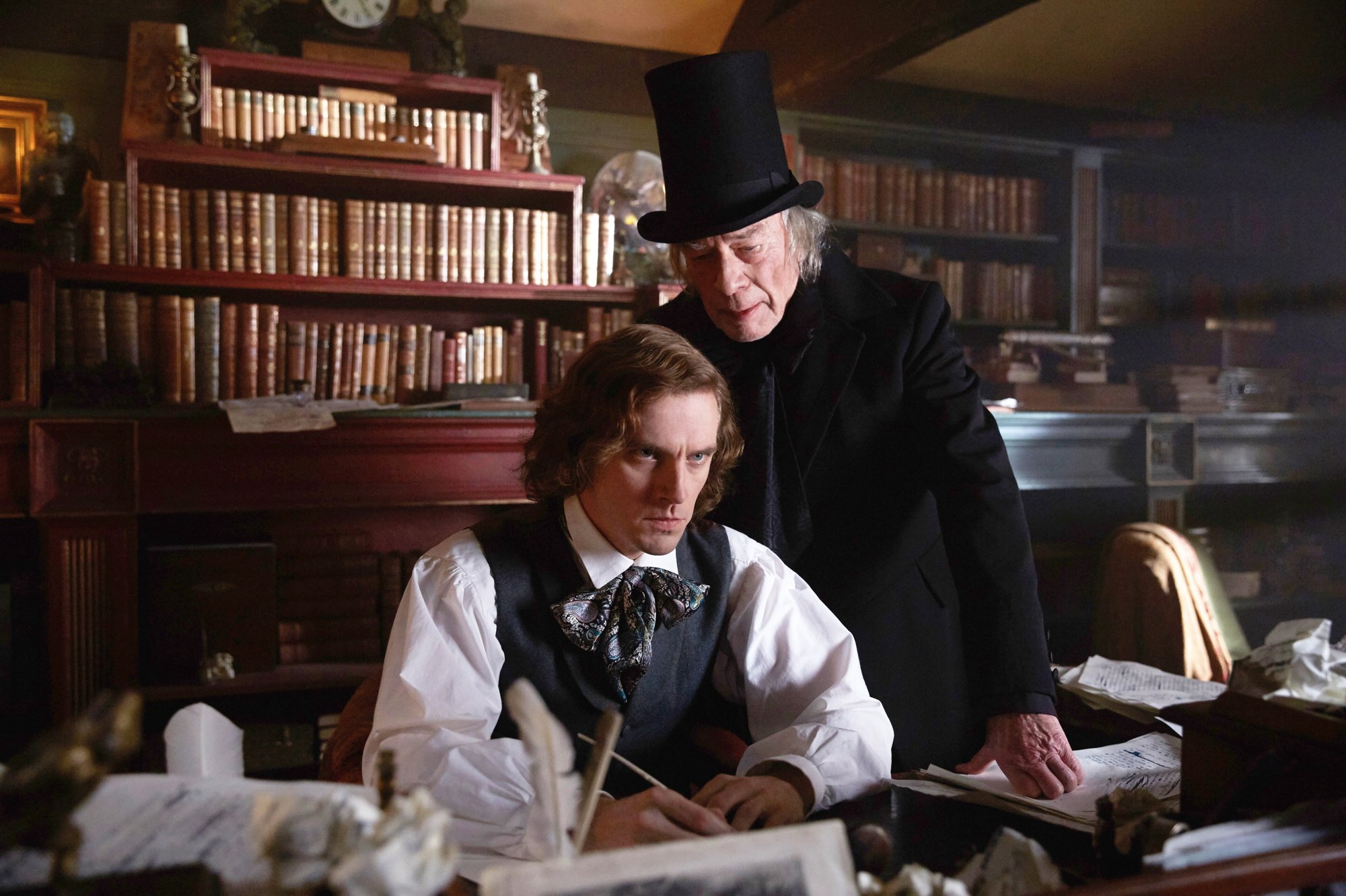 Dan Stevens stars as Charles Dickens and Christopher Plummer stars as Ebenezer Scrooge in Bleecker Street Media's The Man Who Invented Christmas (2017)