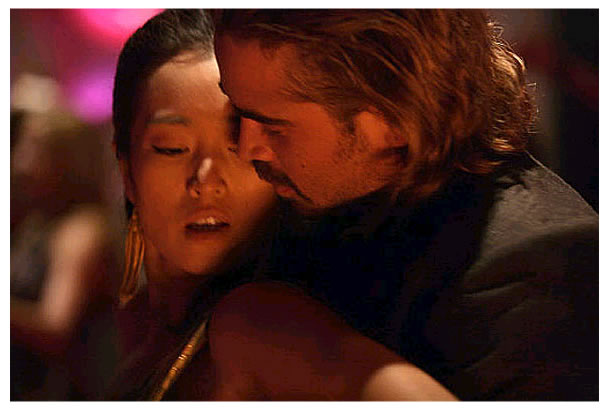 Gong Li as Isabella and Colin Farrell as Det. Sonny Crockett in Universal Pictures' Miami Vice (2006)