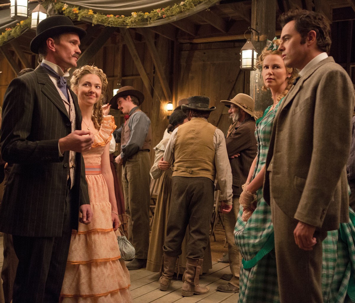 Neil Patrick Harris, Amanda Seyfried, Charlize Theron and Seth MacFarlane in Universal Pictures' A Million Ways to Die in the West (2014)