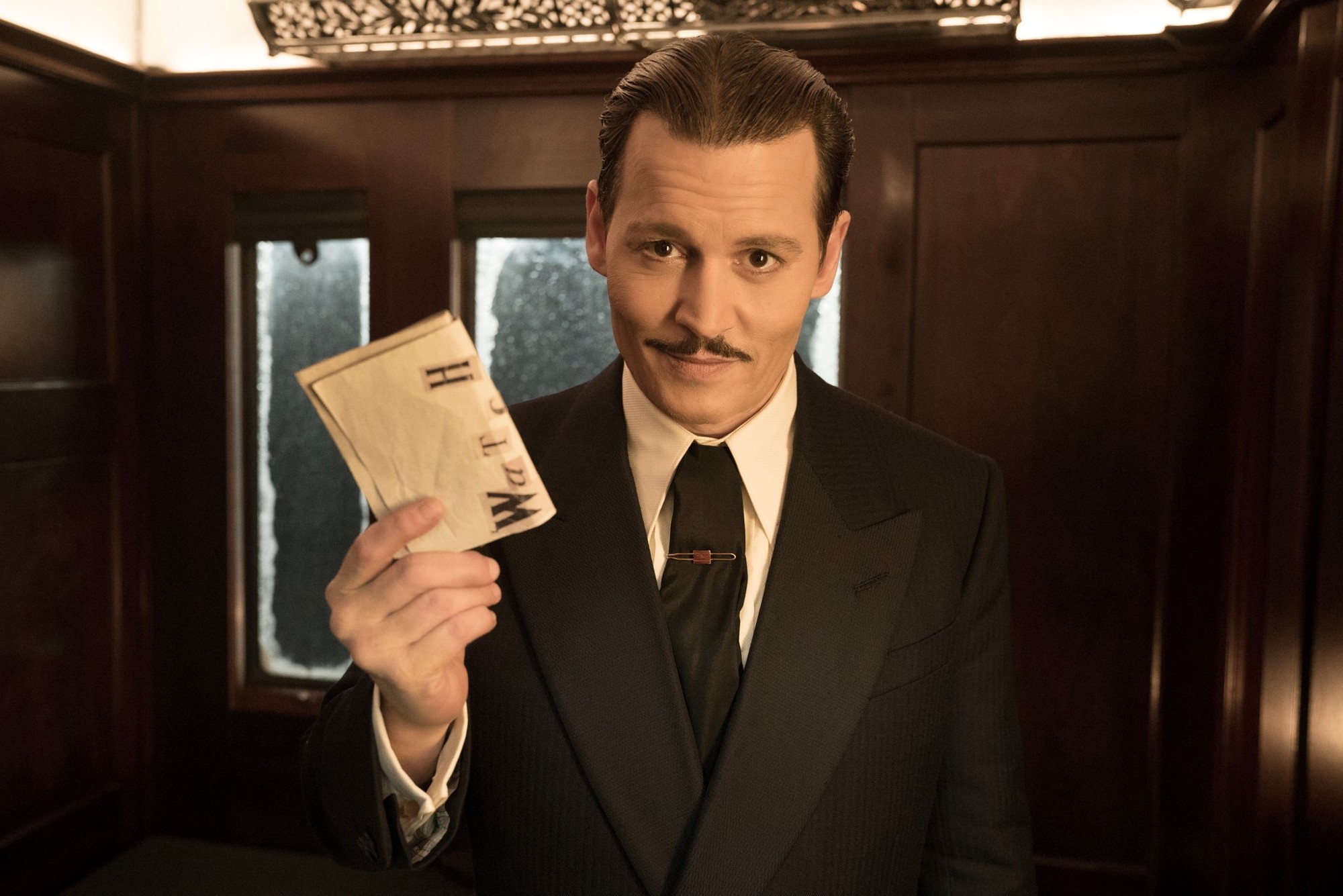 Johnny Depp stars as Ratchett in 20th Century Fox's Murder on the Orient Express (2017)