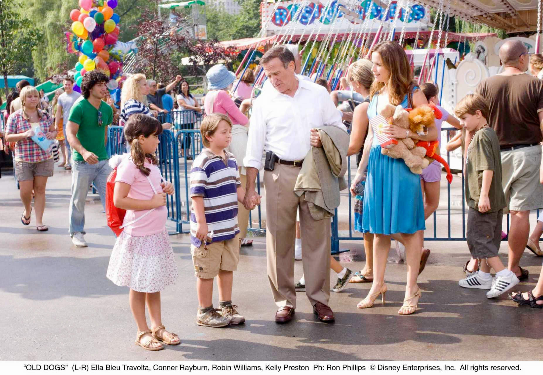 Ella Bleu Travolta, Conner Rayburn, Robin Williams and Kelly Preston in Walt Disney Pictures' Old Dogs (2009). Photo credit by Ron Phillips.