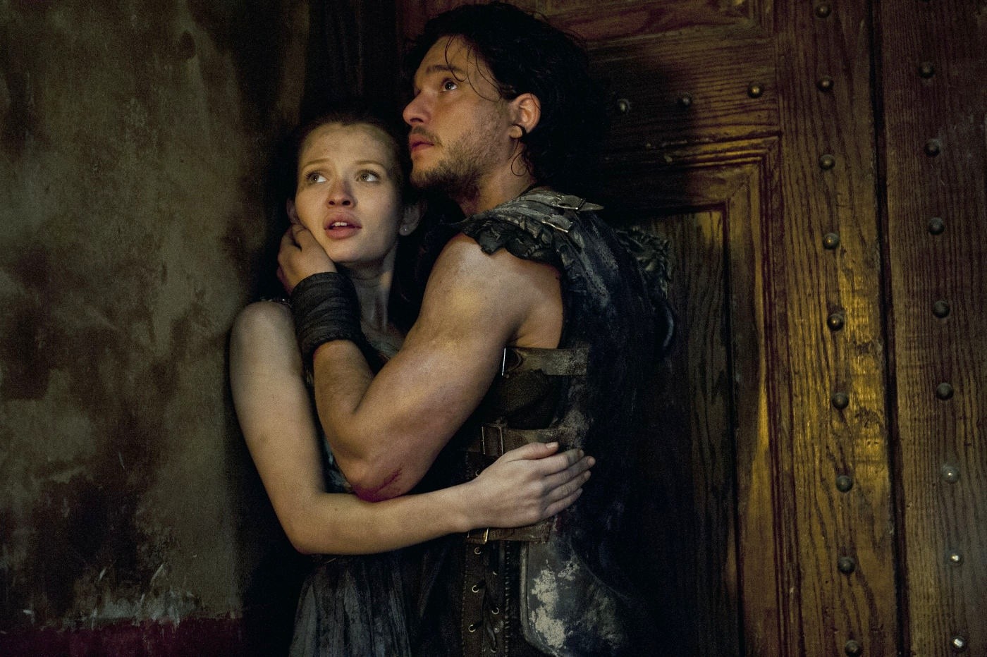 Emily Browning stars as Cassia and Kit Harington stars as Milo in TriStar Pictures' Pompeii (2014)