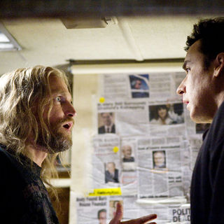 Woody Harrelson stars as Charlie Frost and John Cusack stars as Jackson Curtis in Columbia Pictures' 2012 (2009)