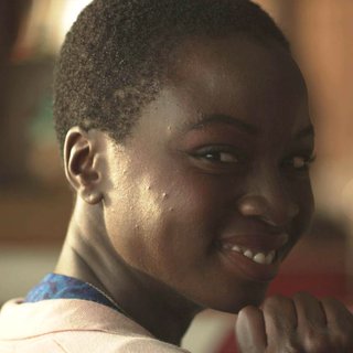 Danai Gurira stars as Woman in Blue Dress in Screen Media Films' 3 Backyards (2011)