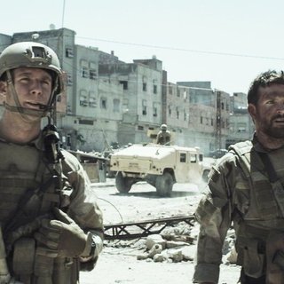Jake McDorman stars as Ryan Job and Bradley Cooper stars as Chris Kyle in Warner Bros. Pictures' American Sniper (2014)
