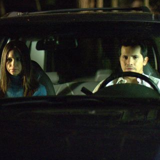 Katherine Waterston as Shirley and John Leguizamo as Michael Beltran in Peace Arch Entertainment's The Babysitters (2008)