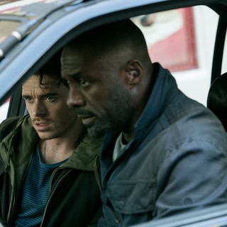Richard Madden stars as Michael Mason and Idris Elba stars as Sean Briar in Focus World's The Take (2016)