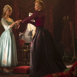 Lily James stars as Cinderella and Cate Blanchett stars as Lady Tremaine in Walt Disney Pictures' Cinderella (2015). Photo credit by Jonathan Olley.