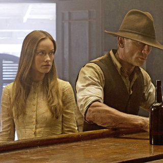 Olivia Wilde stars as Ella and Daniel Craig stars as Jake Lonergan in DreamWorks Pictures' Cowboys and Aliens (2011)