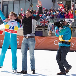 Taron Egerton stars as Eddie Edwards and Hugh Jackman stars as Bronson Peary in 20th Century Fox's Eddie the Eagle (2016)