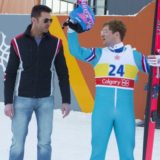 Hugh Jackman stars as Bronson Peary and Taron Egerton stars as Eddie Edwards in 20th Century Fox's Eddie the Eagle (2016)