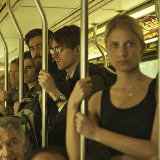 Jake Gyllenhaal stars as Adam Bell/Anthony St. Claire and Melanie Laurent stars as Mary in A24's Enemy (2014)