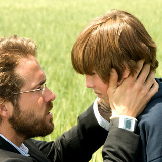 Ryan Reynolds stars as Michael Waechter and Chase Ellison stars as Christopher Lawrence in Senator International's Fireflies in the Garden (2011)