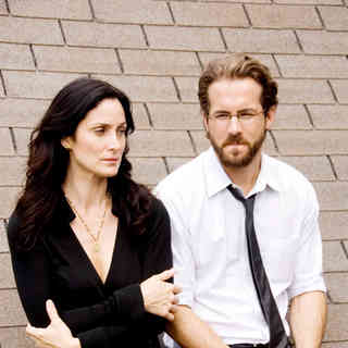 Carrie-Anne Moss stars as Kelly Hanson and Ryan Reynolds stars as Michael Waechter in Senator International's Fireflies in the Garden (2011)