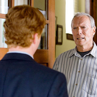 Christopher Carley stars as Father Janovich and Clint Eastwood stars as Walt Kowalski in Warner Bros. Pictures' Gran Torino (2008)