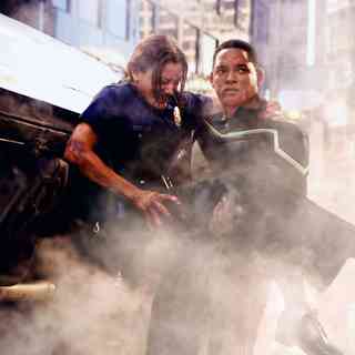 Hancock (Will Smith, right) saves the life of an injured female cop (Liz Wicker, left) before taking out a gang of heavily armed bank robbers in Columbia Pictures' Hancock. Photo credit: Frank Masi SMPSP.