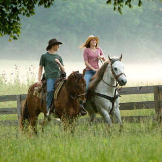 Lucas Till stars as Travis Brody and Miley Cyrus stars as Hannah Montana / Miley Stewart in Walt Disney Pictures' Hannah Montana: The Movie (2009). Photo credit by Sam Emerson.