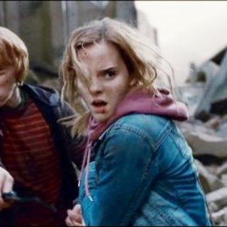 Rupert Grint stars as Ron Weasley and Emma Watson stars as Hermione Granger in Warner Bros. Pictures' Harry Potter and the Deathly Hallows: Part I (2010)