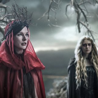 Milla Jovovich stars as Nimue the Blood Queen and Penelope Mitchell stars as Ganeida in Lionsgate Films' Hellboy (2019)