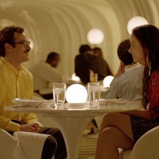 Joaquin Phoenix stars as Theodore and Olivia Wilde stars as Theodore's Blind Date in Warner Bros. Pictures' Her (2013)