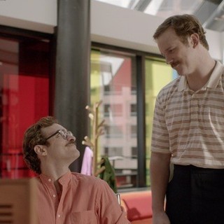 Joaquin Phoenix stars as Theodore and Chris Pratt stars as Paul in Warner Bros. Pictures' Her (2013)