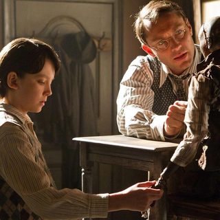 Asa Butterfield stars as Hugo Cabret and Jude Law stars as Hugo's Father in Paramount Pictures' Hugo (2011)