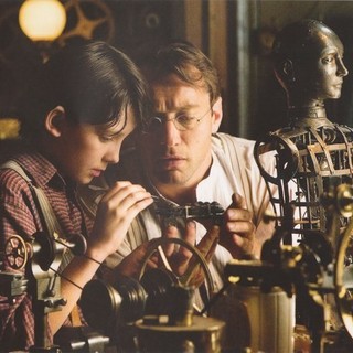 Asa Butterfield stars as Hugo Cabret and Jude Law stars as Hugo's Father in Paramount Pictures' Hugo (2011)