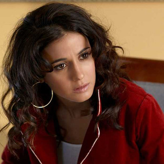 Emmanuelle Chriqui as Dolly Pacelli, the daughter of mob boss in 
