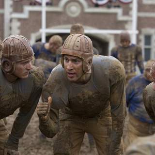 War hero Carter Rutherford (JOHN KRASINSKI) huddles with his team in Universal Pictures' Leatherheads (2008).