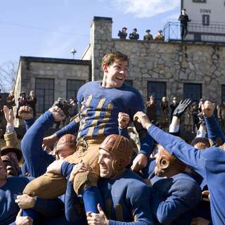 War hero Carter Rutherford (JOHN KRASINSKI) gets carried off the field in Universal Pictures' Leatherheads (2008).