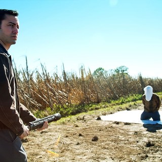 Joseph Gordon-Levitt stars as Joe and Bruce Willis stars as Older Joe in TriStar Pictures' Looper (2012)