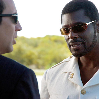 Nicolas Cage and Eamonn Walker in Lions Gate Films' Lord of War (2005)