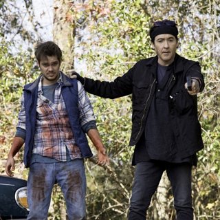 Ellar Coltrane stars as Victor and John Cusack stars as Miller in Saban Films' Blood Money (2017)
