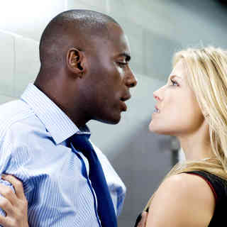 Idris Elba stars as Derek Charles and Ali Larter stars as Lisa Sheridan in Screen Gems' Obsessed (2009). Photo credit by Suzanne Tenner.