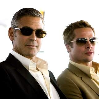 George Clooney as Danny Ocean and Brad Pitt as Rusty Ryan in Warner Bros' Ocean's Thirteen (2007)