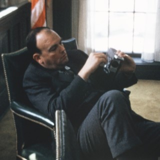 Chief Domestic Advisor John Ehrlichman fiddles with his Super 8 camera during a particularly boring staff meeting at the White House