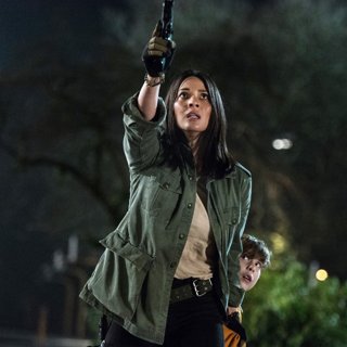 Olivia Munn stars as Casey Bracket and Jacob Tremblay stars as Rory McKenna in 20th Century Fox's The Predator (2018)