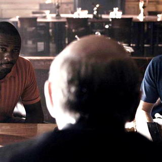 Idris Elba stars as Mumbles and Gerard Butler stars as One Two in Warner Bros Pictures' RocknRolla (2008)